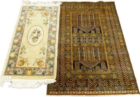 A Belgian cotton Persian type rug, with a design of medallions, within multiple borders, and a Chinese rug. (2)