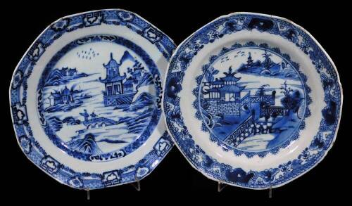 A pair of 18thC Chinese blue and white plates, each of octagonal form with an outer floral and garland border, each decorated with figures on a bridge before buildings, birds and mountains, unmarked, 23.5cm W. (2)