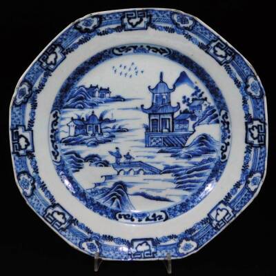 A pair of 18thC Chinese blue and white plates, each of octagonal form with an outer floral and garland border, each decorated with figures on a bridge before buildings, birds and mountains, unmarked, 23.5cm W. (2) - 2