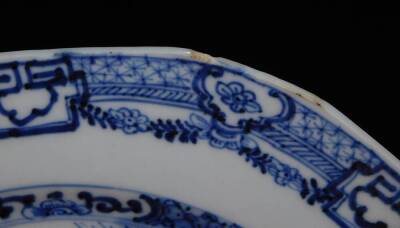 A pair of 18thC Chinese blue and white plates, each of octagonal form with an outer floral and garland border, each decorated with figures on a bridge before buildings, birds and mountains, unmarked, 23.5cm W. (2) - 4