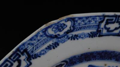 A pair of 18thC Chinese blue and white plates, each of octagonal form with an outer floral and garland border, each decorated with figures on a bridge before buildings, birds and mountains, unmarked, 23.5cm W. (2) - 5
