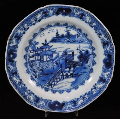 A pair of 18thC Chinese blue and white plates, each of octagonal form with an outer floral and garland border, each decorated with figures on a bridge before buildings, birds and mountains, unmarked, 23.5cm W. (2) - 6