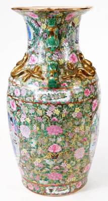 A large pair of Chinese Canton vases, each of shouldered form, decorated with panels of figures, with areas profusely decorated with flowers, predominantly in pink, yellow, and green, with raised dragon and chilin handles, double red circle with spurious - 3