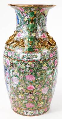 A large pair of Chinese Canton vases, each of shouldered form, decorated with panels of figures, with areas profusely decorated with flowers, predominantly in pink, yellow, and green, with raised dragon and chilin handles, double red circle with spurious - 5