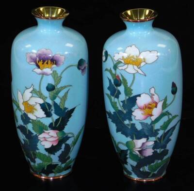 A pair of Meiji period Japanese cloisonne vases, each of shouldered form, decorated with poppies on a light blue ground, unmarked, 19cm H. (2)