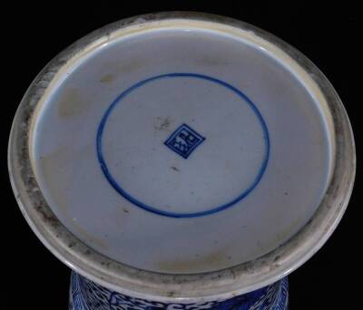 A Chinese porcelain blue and white beaker vase, with flared base and neck, decorated with scrolling lotus designs in underglaze blue, between Greek key fret, scroll and dot bands, glazed base with double ring and two character mark, 19thC, 45cm H. - 4