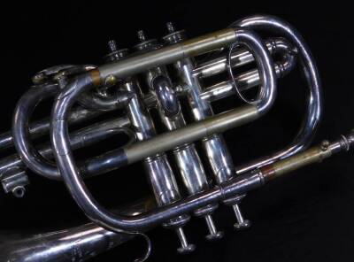 A rare Antione Courtois Brevete Conservatoire 1872 patent trumpet, in chrome with shaped mouth piece, three buttons and titled horn, 32cm W. - 4