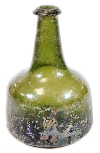 A small onion shaped green glass bottle, with original painted sections, in silvered decoration with concave base and cylindrical stem, 17cm H.