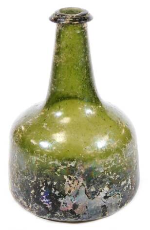 A small onion shaped green glass bottle, with original painted sections, in silvered decoration with concave base and cylindrical stem, 17cm H.