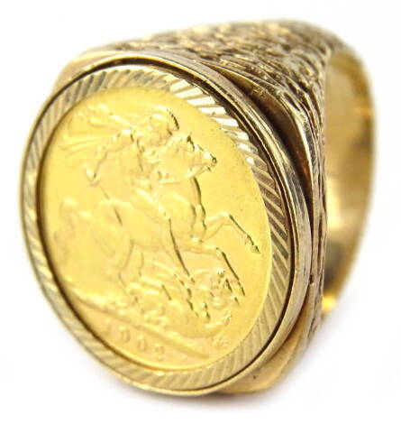 A 9ct full gold sovereign ring, containing an Edward VII 1902 full gold sovereign, in a textured 9ct gold mount, 42.9g all in.