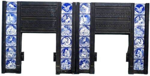 A pair of Victorian cast iron fire surrounds, each set with twelve Minton tiles, printed in blue with a design of Aesops Fables, after Moyr-Smith, 97cm H, 97.5cm W. Provenance: Removed from Leyland House, Nettleham Road, Lincoln. The house was designed by