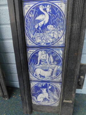 A pair of Victorian cast iron fire surrounds, each set with twelve Minton tiles, printed in blue with a design of Aesops Fables, after Moyr-Smith, 97cm H, 97.5cm W. Provenance: Removed from Leyland House, Nettleham Road, Lincoln. The house was designed by - 8