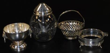 A glass sugar caster, engraved with birds and flowerheads, with silver cap, 11cm H, a silver circular dish frame, silver bonboniere basket, Birmingham 1912, and a miniature silver rose bowl with lion's head handles, 5.67oz weighable silver. (4)