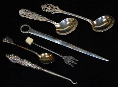 A small Victorian silver skewer, 15cm L, London 1863, 0.50oz, two continental preserve spoons, button hook, etc.