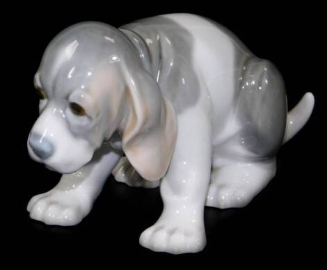 A Lladro figure of a puppy, no. D-60N, printed and impressed marks beneath, 9cm H.