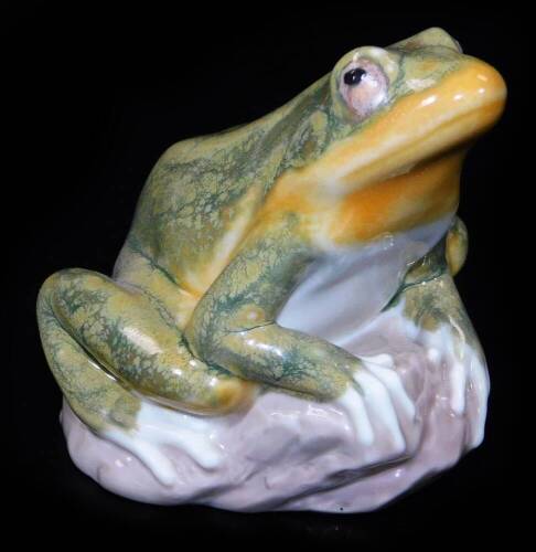 A Lladro figure of a frog, printed marks beneath, 8cm H.