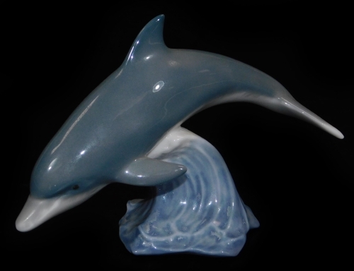 A Lladro figure of a dolphin, printed marks beneath, 8cm H.