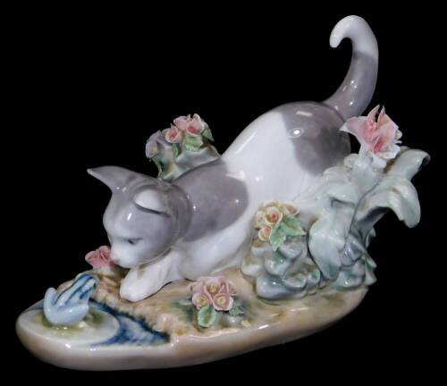 A Lladro figure group of kitten and frog, printed marks beneath, 10cm H.