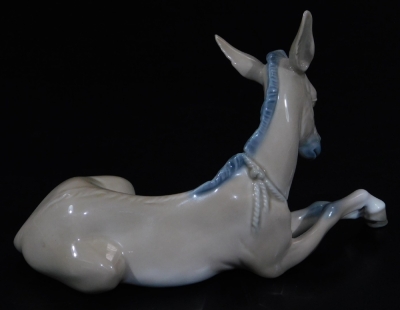 A Lladro figure of a recumbent donkey, printed marks beneath, 10cm H. - 2