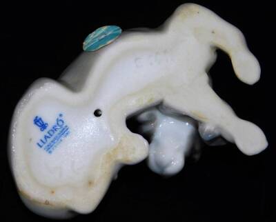 A Lladro figure of a sleeping puppy, printed marks beneath, 7cm W. - 3