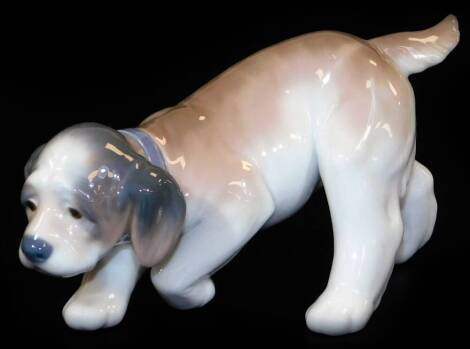 A Lladro figure of a creeping puppy, printed marks beneath, 8cm H.