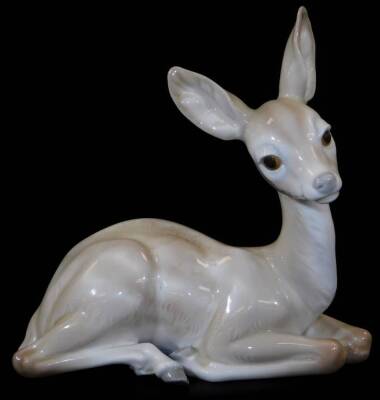 A Lladro figure of a recumbent fawn, no. E30 O33, printed and impressed marks beneath, 16cm H.