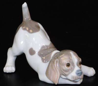 A Lladro figure of a puppy, head lowered, no.A16JU, printed and impressed marks beneath, 16cm W.