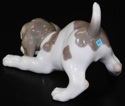 A Lladro figure of a puppy, head lowered, no.A16JU, printed and impressed marks beneath, 16cm W. - 2