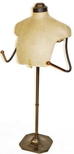 A 1920's tailors dummy, torso only, on turned stem and octagonal base ...
