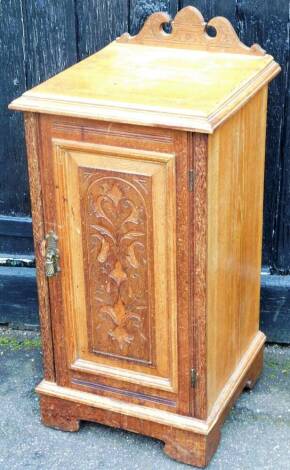 A late 19thC stained oak and pine pot cupboard, of square form with shaped cornice, raised above a panelled door, on bracket feet, 76cm H, 44cm D.