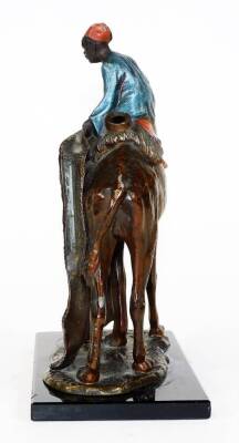 A cast and painted spelter figural table lighter, in the manner of Bergmann, formed as an Arabian rug seller on a camel's back, aside a further figure, on a rectangular base, 19cm H. (AF) - 4