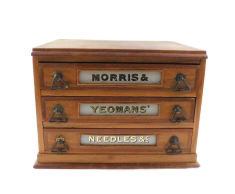 A late 19thC Morris and Yeoman's oak haberdashery chest, of three drawers, named to each drawer, respectively 'Morris and Yeoman's Needles and c', raised on a plinth base, 27cm H, 38.5cm W, 28.5cm D.