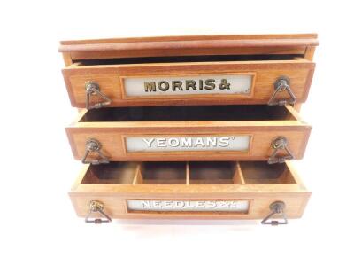 A late 19thC Morris and Yeoman's oak haberdashery chest, of three drawers, named to each drawer, respectively 'Morris and Yeoman's Needles and c', raised on a plinth base, 27cm H, 38.5cm W, 28.5cm D. - 3