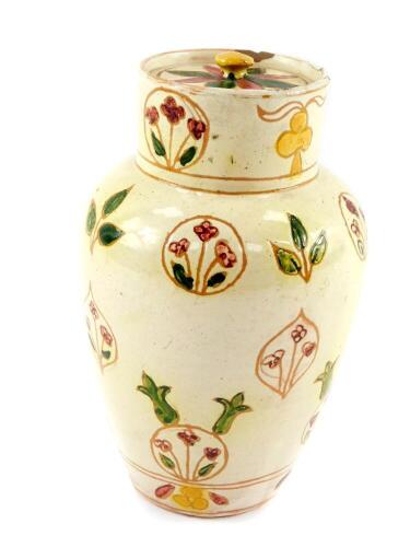 A late 19thC Della Robbia Arts & Crafts pottery jar and cover, of shouldered tapering form, painted with floral and foliate motifs, incised marks, 17cm H.