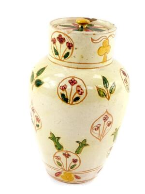 A late 19thC Della Robbia Arts & Crafts pottery jar and cover, of shouldered tapering form, painted with floral and foliate motifs, incised marks, 17cm H.