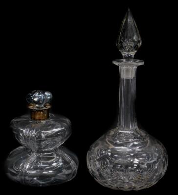 A late 19thC cut glass decanter and stopper, of compressed hour glass form, with silver collar, Thomas Whitehouse, London 1896, 18cm H, together with a cut glass globe and shaft decanter, 33.5cm H. (2)