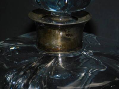 A late 19thC cut glass decanter and stopper, of compressed hour glass form, with silver collar, Thomas Whitehouse, London 1896, 18cm H, together with a cut glass globe and shaft decanter, 33.5cm H. (2) - 3