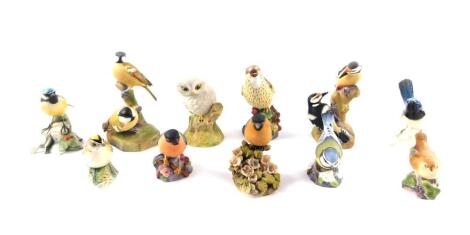 Royal Worcester porcelain figures of birds, including a thrush, pied woodpeckers, coal tits, and a wren, together with Karl Ens, Beswick and other porcelain and pottery figures of birds. (11)