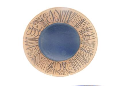 A 20thC Gustavsberg pottery dish, designed by Lisa Larson, with a cobalt blue centre within a border sgraffito decorated with stylised trees, printed mark, 7.5cm Dia., together with a rectangular wall plaque, moulded with flowers, by Jie Gantofta, No 893, - 4