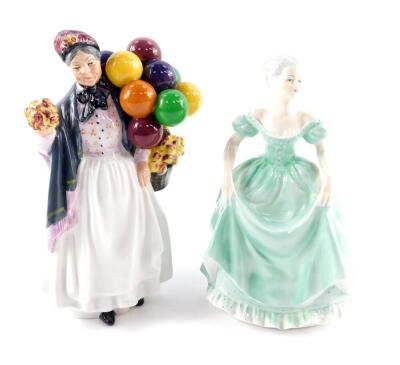 A Royal Doulton figure modelled as Biddy Penny Farthing HN1843, together with a Coalport figure, Ladies of Fashion, modelled as Henrietta. (2)