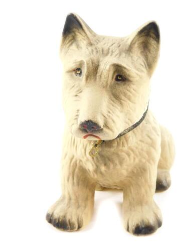 A 1930's pottery figure of a terrier, modelled seated, with a fabric collar and brass lead loop, pencil dedicated to base, Christmas 1931, 14.5cm H.