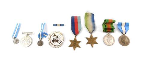 Four WWII medals, comprising Atlantic Star, 1939-1945 Star, Defence and War Medals, together with a United Nations Cyprus Medal, and two miniatures, and a United Nations enamel badge.