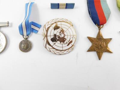 Four WWII medals, comprising Atlantic Star, 1939-1945 Star, Defence and War Medals, together with a United Nations Cyprus Medal, and two miniatures, and a United Nations enamel badge. - 3