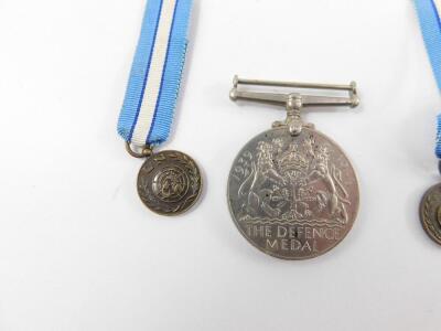 Four WWII medals, comprising Atlantic Star, 1939-1945 Star, Defence and War Medals, together with a United Nations Cyprus Medal, and two miniatures, and a United Nations enamel badge. - 4