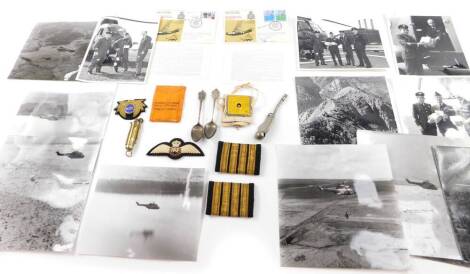 A group of militaria, including a brass pocket lighter, a pair of Royal Navy captain's epaulettes, bosun's whistle, emergency razor blade, heliograph, first day cover for The Royal Air Force No 230 Squadron, and two silver teaspoons, with embossed termina