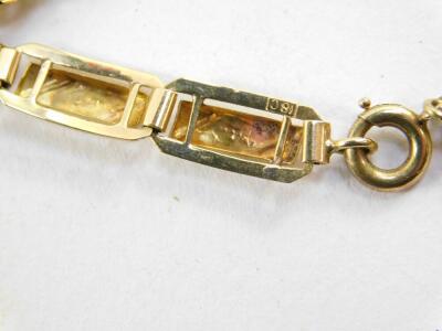 A bicolour rectangular link bracelet, on a bolt ring clasp, stamped 18ct, 6.2g. - 3