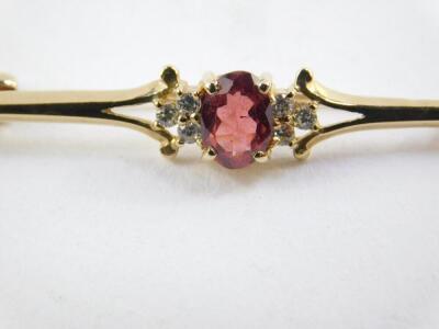 A Victorian 9ct gold bar brooch, 9ct gold and gem set bar brooch, and a Victorian seed pearl and ruby ring, set in yellow metal, size P, 6.6g. (3) - 2