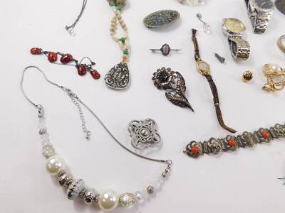 Silver and costume jewellery, including an Art Nouveau silver brooch, embossed with cherubs and flowers, circular agate brooch, beads, bangles, watches, and charms. (qty) - 2