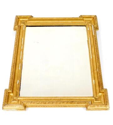 A Georgian style gilt wood and gesso wall mirrror, of rectangular section, with fluted and harebell moulding, inset bevelled glass, bears label verso, Mercury, Regd Trademark, 78cm H, 62cm W.