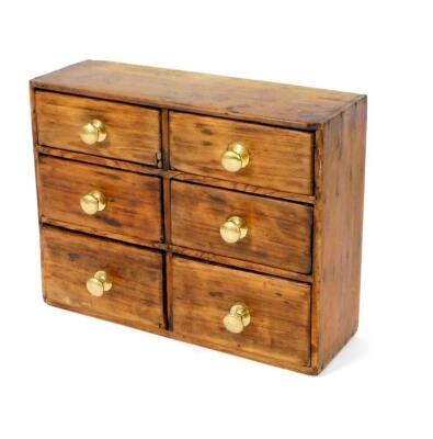 A pine and stained wood spice chest, of six drawers, in a rectangular casing, 37cm H, 47cm W, 16cm D.